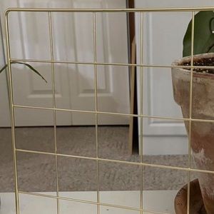 gold metal grid wall panel display